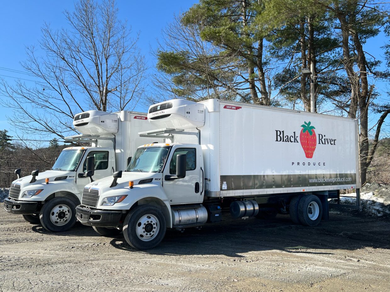 2 new delivery foodservice trucks with black river produce logo