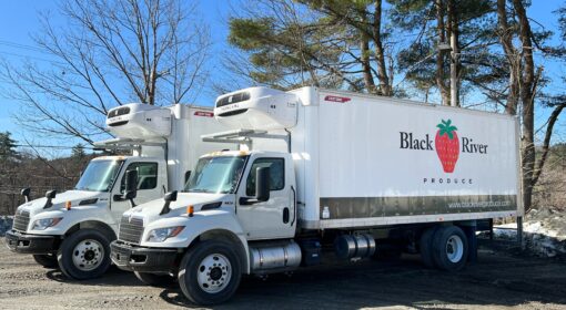 2 new delivery foodservice trucks with black river produce logo